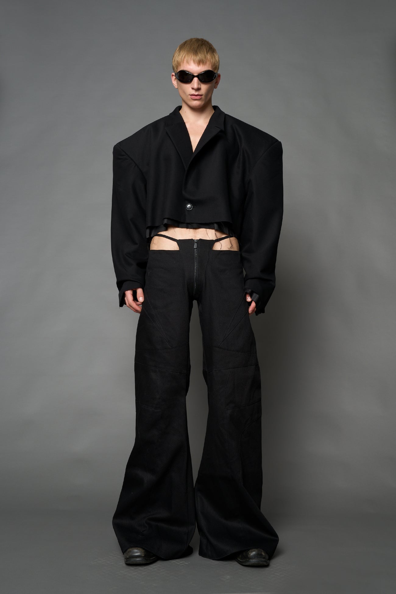 Black Namilia cropped blazer with oversized padded shoulders, single button closure and boxy silhouette