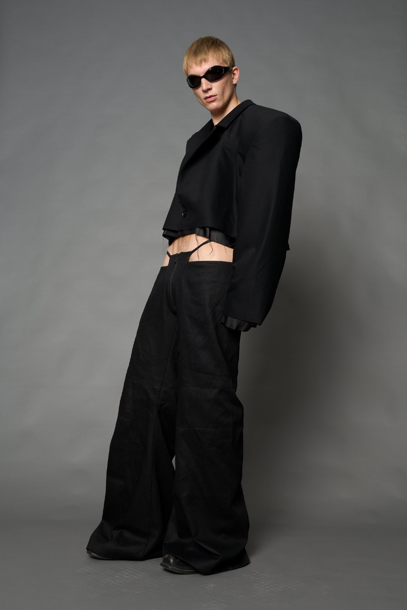 Black Namilia cropped blazer with oversized padded shoulders, single button closure and boxy silhouette
