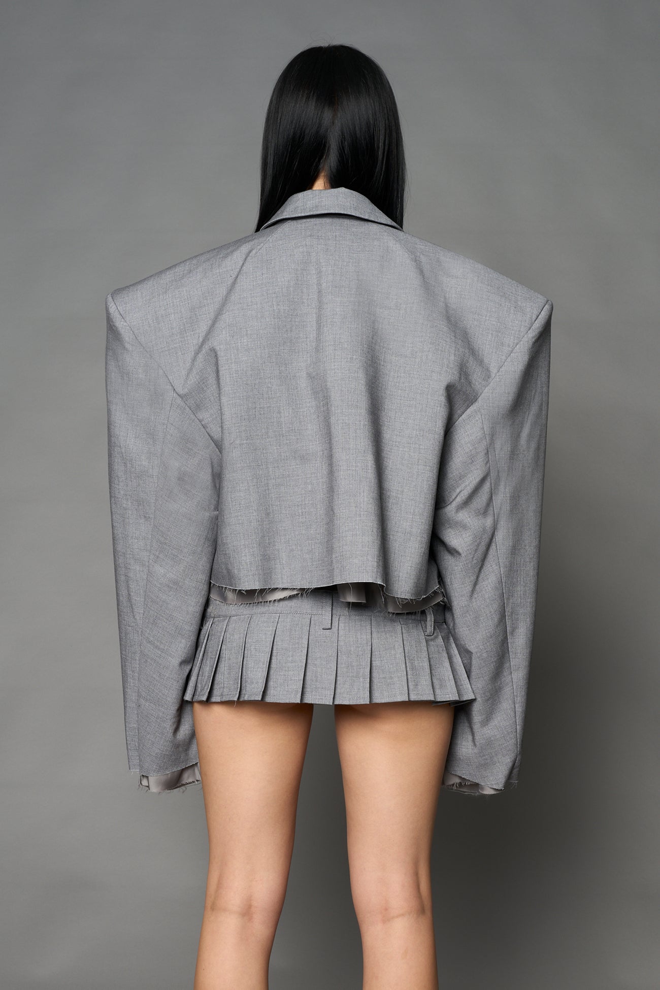Grey Namilia cropped blazer with oversized padded shoulders, single button closure and boxy silhouette