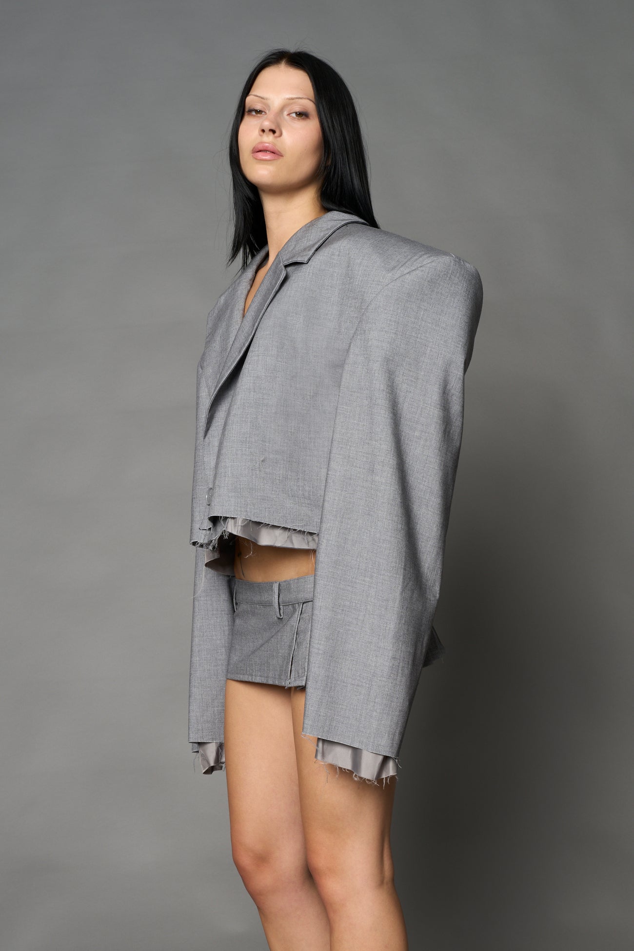 Grey Namilia cropped blazer with oversized padded shoulders, single button closure and boxy silhouette