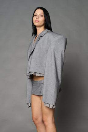 Grey Namilia cropped blazer with oversized padded shoulders, single button closure and boxy silhouette