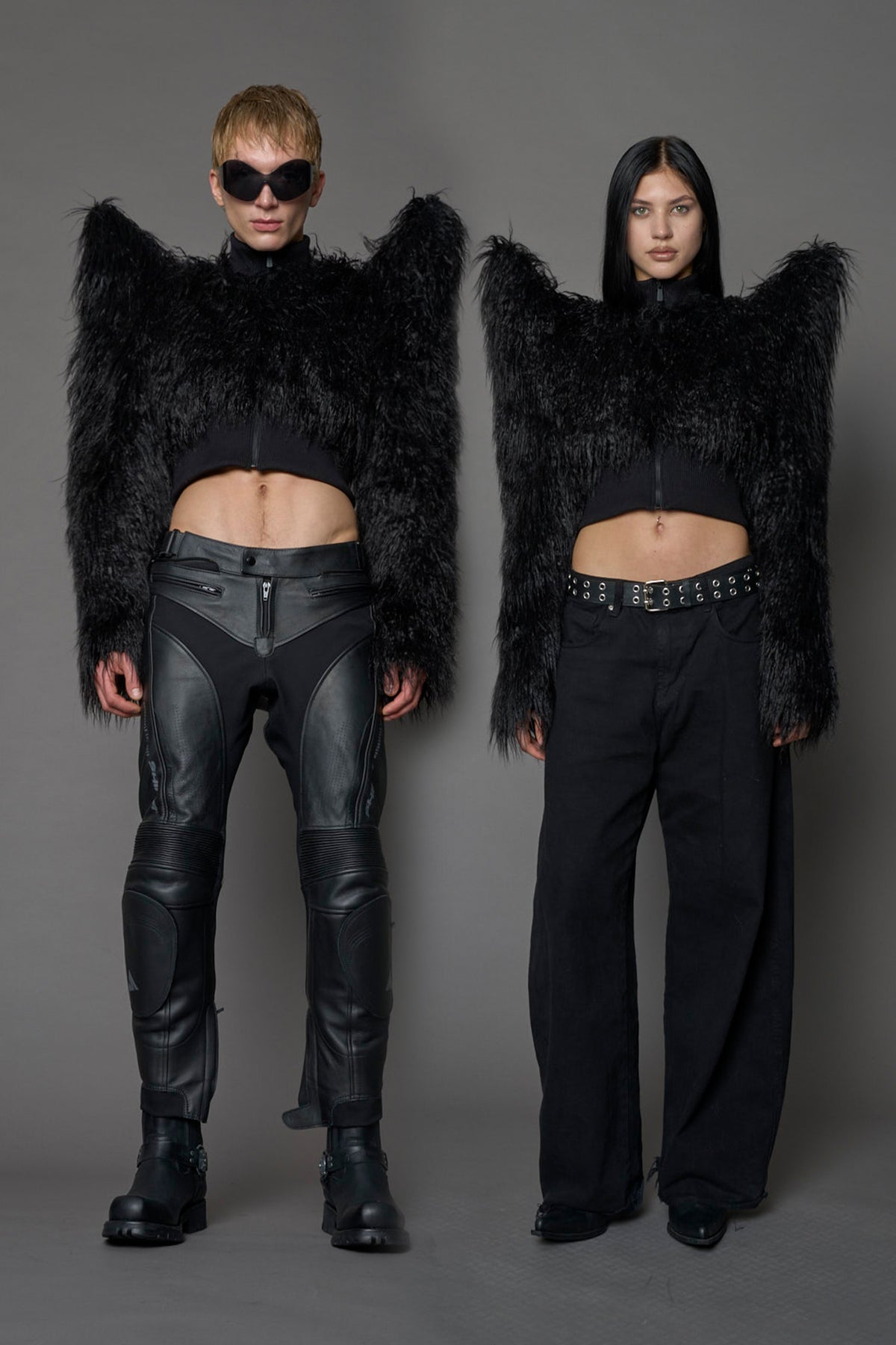 Model wearing black spike shoulder crop faux fur coat
