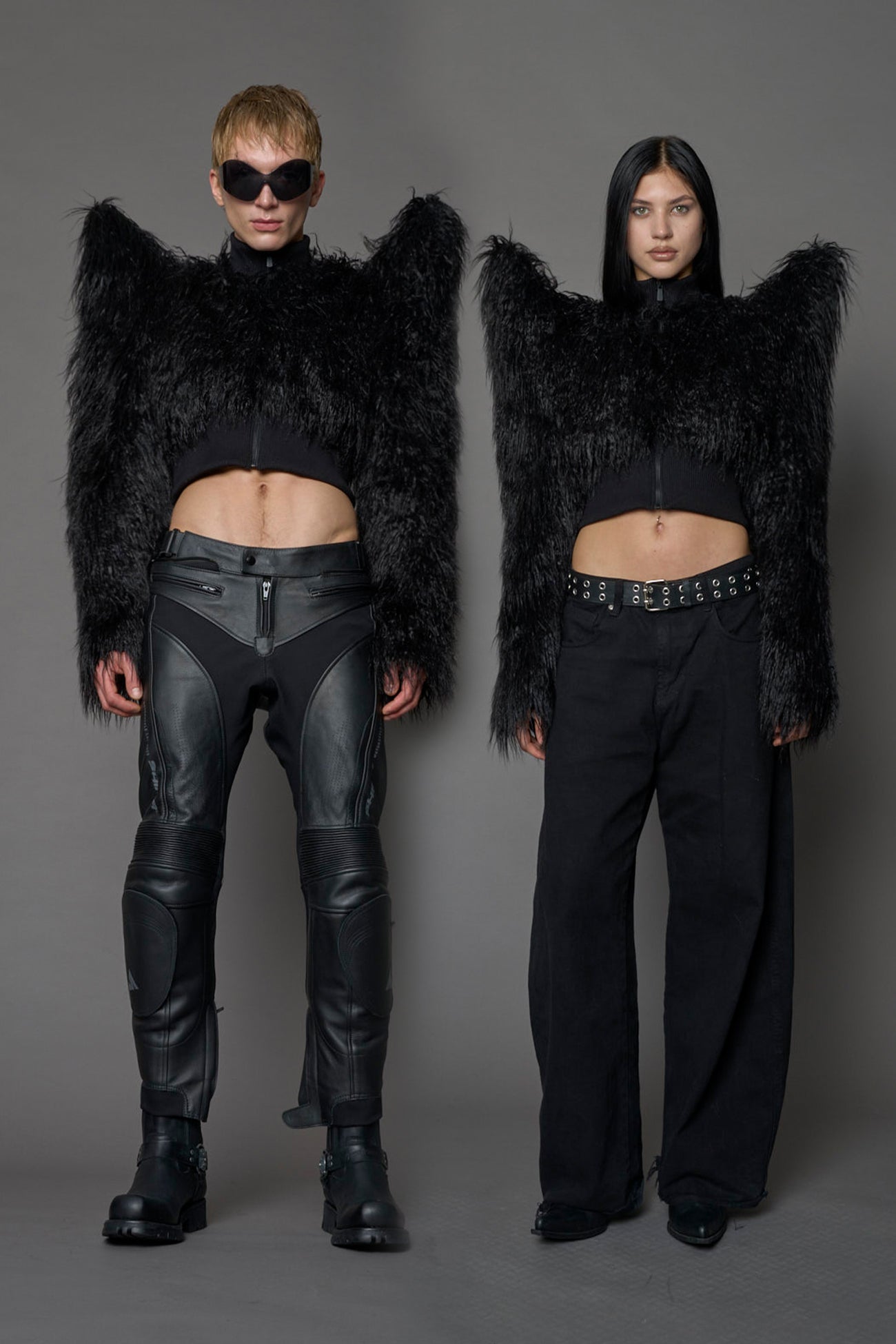 Model wearing black spike shoulder crop faux fur coat