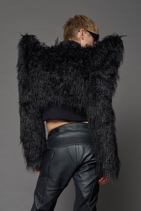 Model wearing black spike shoulder crop faux fur coat
