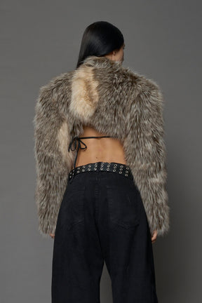 brown cropped faux fur jacket with exaggerated shoulders and high neck – bold statement outerwear for nightlife, streetwear, or runway looks.