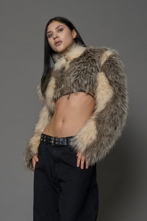 brown cropped faux fur jacket with exaggerated shoulders and high neck – bold statement outerwear for nightlife, streetwear, or runway looks.