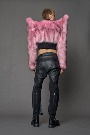 Model wearing pink spike shoulder crop faux fur coat