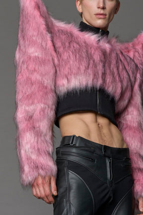Model wearing pink spike shoulder crop faux fur coat