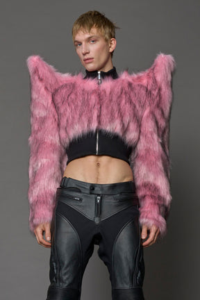 Model wearing pink spike shoulder crop faux fur coat