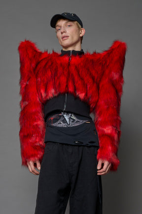 Model wearing red spike shoulder crop faux fur coat