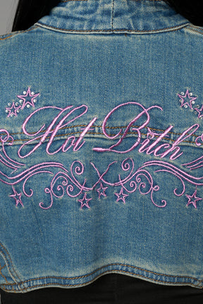 Namilia blue cropped denim bolero jacket with exaggerated shoulders and pink embroidery on back
