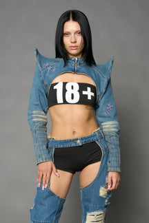 Namilia blue cropped denim bolero jacket with exaggerated shoulders and pink embroidery on back