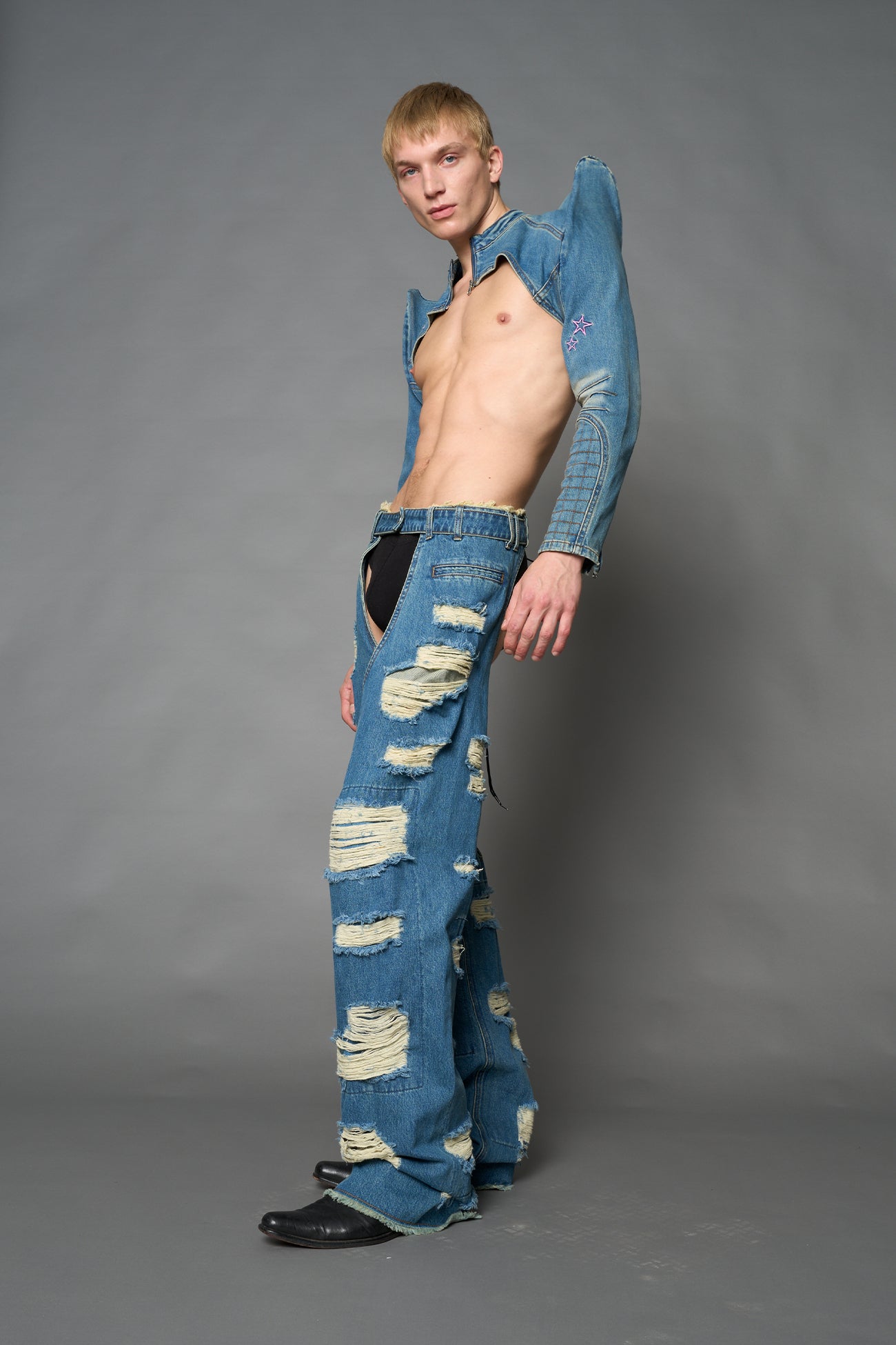Namilia blue cropped denim bolero jacket with exaggerated shoulders and pink embroidery on back