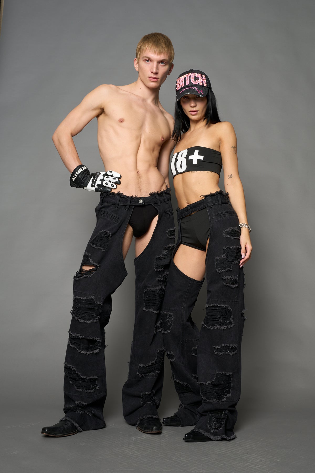 Namilia shredded black denim chaps with low-rise fit, extreme thigh cut-outs and distressed straight legs