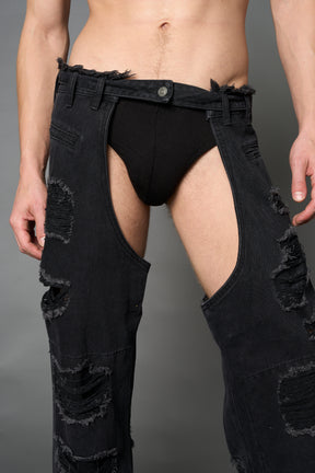 Namilia shredded black denim chaps with low-rise fit, extreme thigh cut-outs and distressed straight legs