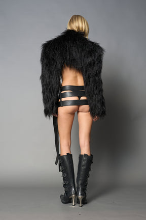 Black cropped faux fur jacket with exaggerated shoulders and high neck – bold statement outerwear for nightlife, streetwear, or runway looks.