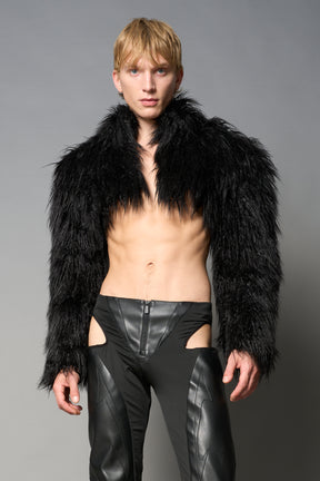 Black cropped faux fur jacket with exaggerated shoulders and high neck – bold statement outerwear for nightlife, streetwear, or runway looks.