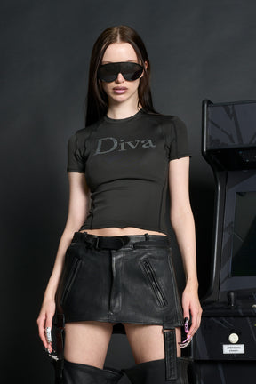 Model wears a black short-sleeved stretch lycra t-shirt with racing-style lines , black coverstitch seams, and a rhinestoned slogan.