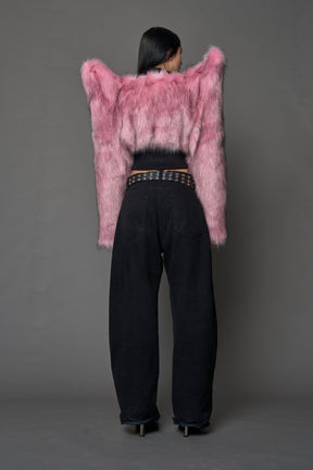 Model wearing pink spike shoulder crop faux fur coat
