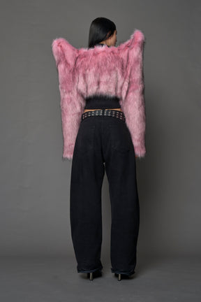 Model wearing pink spike shoulder crop faux fur coat