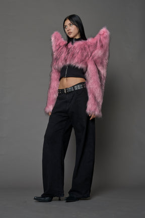 Model wearing pink spike shoulder crop faux fur coat