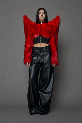 Model wearing red spike shoulder crop faux fur coat