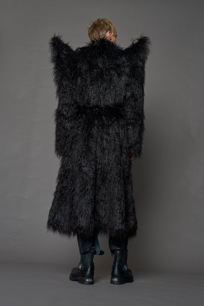 model wearing black spike shoulder long faux fur coat