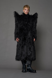 model wearing black spike shoulder long faux fur coat