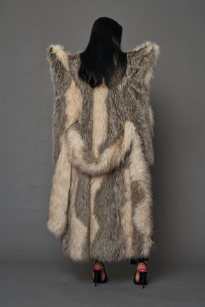 model wearing brown spike shoulder long faux fur coat