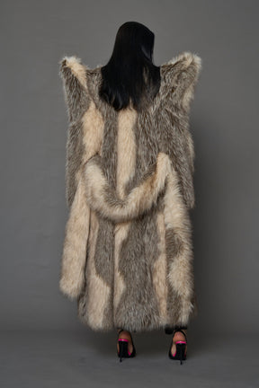 model wearing brown spike shoulder long faux fur coat