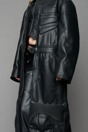 Detachable moto long coat in black vegan black leather inspired by a deconstructed full-body motocross racing suit, featuring padded panel details and a detachable zip design for two-way wear.