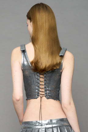 model wearing silver plated mini pleated denim corset