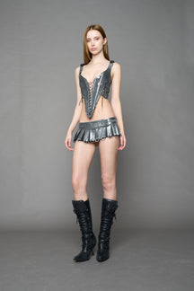 model wearing silver plated mini pleated denim skirt 