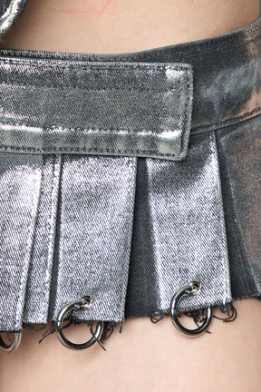 model wearing silver plated mini pleated denim skirt 