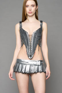 model wearing silver plated mini pleated denim corset