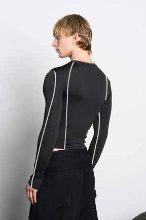 male model wearing black lycra longsleeve with rhinestone crystal slogan