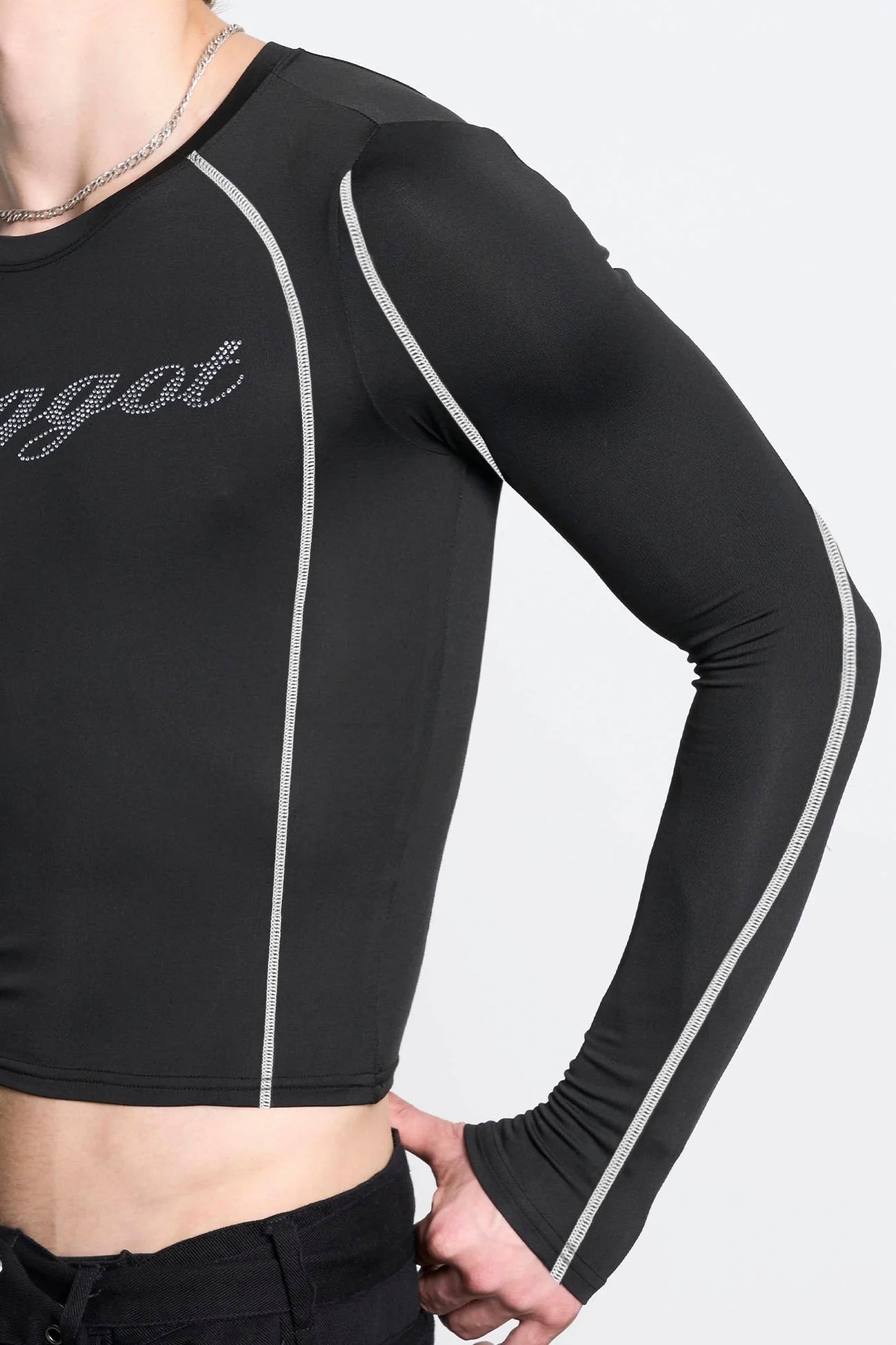 male model wearing black lycra longsleeve with rhinestone crystal slogan