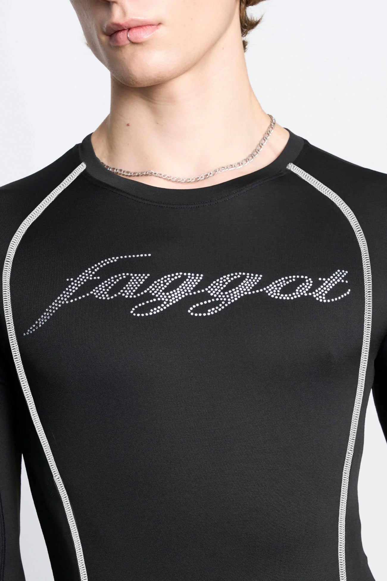 male model wearing black lycra longsleeve with rhinestone crystal slogan