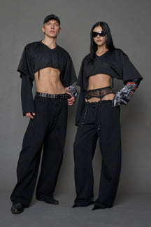 male and female model wearing a black cropped football inspired T-Shirt with a goth-inspired print