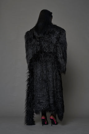 black faux fur coat with shoulder pads and  belt