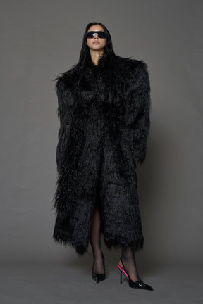 black faux fur coat with shoulder pads and  belt