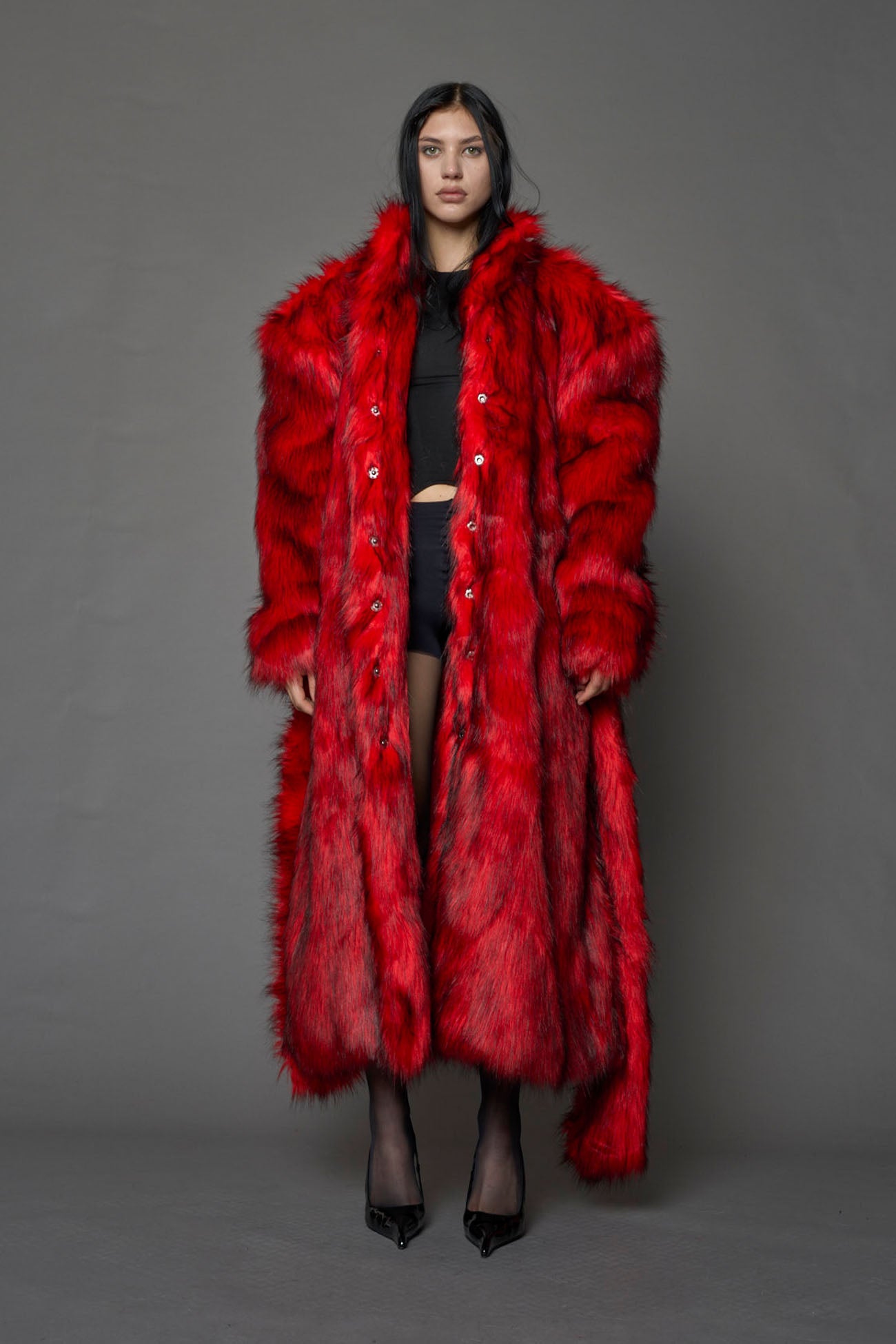 red faux fur coat with shoulder pads and  belt