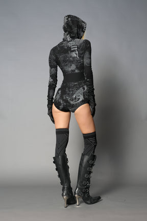 model wearing soft jersey black print bodysuit with longsleeves and drawstring hood