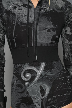 model wearing soft jersey black print bodysuit with longsleeves and drawstring hood