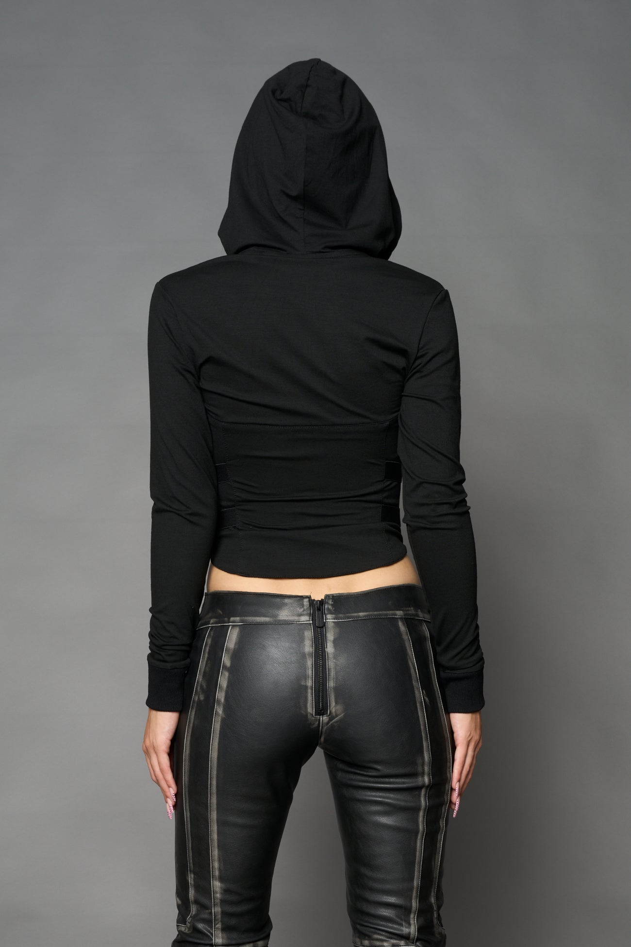 Black Namilia zip-up hoodie with built-in corset, lace-up front, cut-out sides and drawstring hood