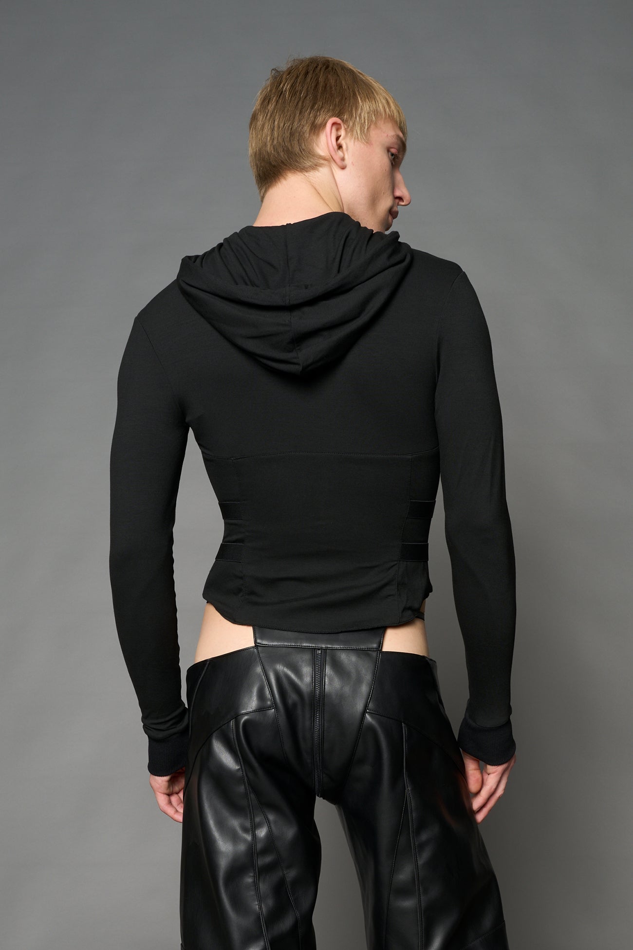 Black Namilia zip-up hoodie with built-in corset, lace-up front, cut-out sides and drawstring hood