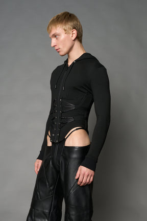 Black Namilia zip-up hoodie with built-in corset, lace-up front, cut-out sides and drawstring hood