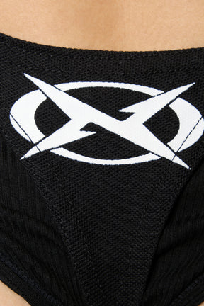 Black Namilia polo bodysuit with biker graphic print, cut-out sides, O-ring strap details and thong back with X logo
