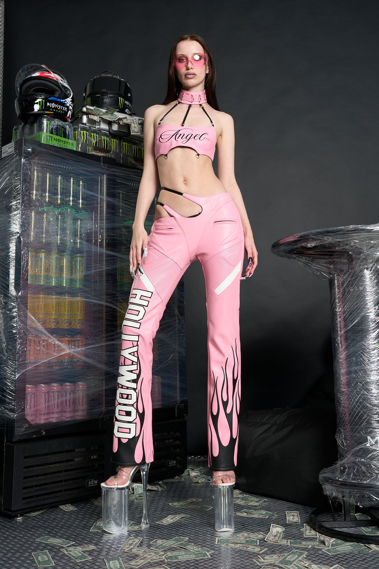 Namilia ‘Angel Choker Top’ – edgy vegan leather bandeau top with adjustable collar, cursive 'Angel' graphic, mesh panels, chrome hardware, and elastic back straps. pink version