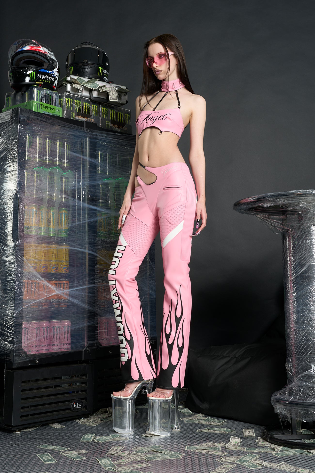 Namilia ‘Angel Choker Top’ – edgy vegan leather bandeau top with adjustable collar, cursive 'Angel' graphic, mesh panels, chrome hardware, and elastic back straps. pink version